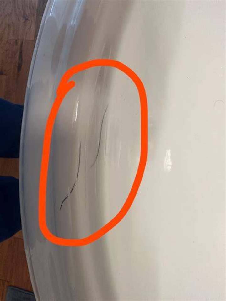 How do you get scratches out of a white cast iron sink?
